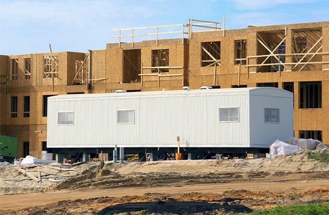 crane lifting modular building for construction office rentals in Antioch